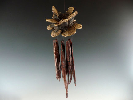 Obsidian Chime with Banksia Laricina Cone.  12" Long from Top of Hanger & 3" Wide. 